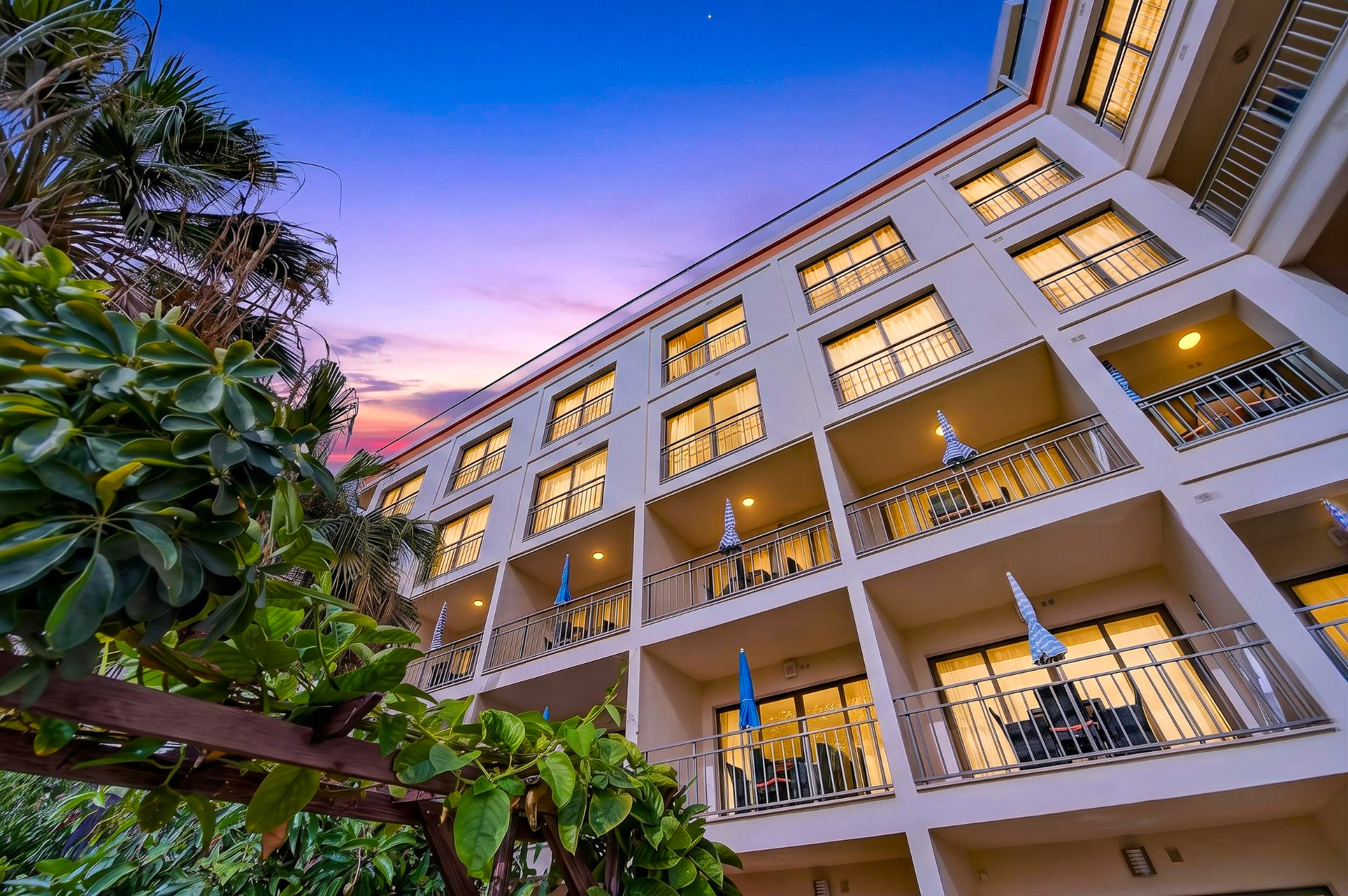 The illuminated balconies of Elisium at dusk